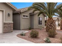 Charming single-story home featuring desert landscaping and a welcoming front entrance at 870 Santa Maria Way, Mesquite, NV 89027
