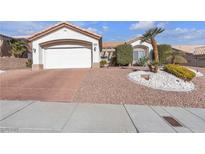 Charming single-story home featuring desert landscaping, a two-car garage and an inviting front entrance at 10708 Clear Meadows Dr, Las Vegas, NV 89134