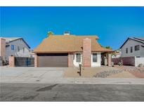 Charming single-Gathering home features a two-car garage and low maintenance desert landscaping at 1904 Roxbury Ln, Las Vegas, NV 89119