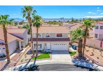 Charming two-story home featuring a well-manicured front yard and a two-car garage at 3205 Antilles Ct, Las Vegas, NV 89117