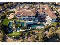 Expansive estate featuring multiple pools, a putting green, tennis court, and luxurious living spaces at 48 Augusta Canyon Way, Las Vegas, NV 89141