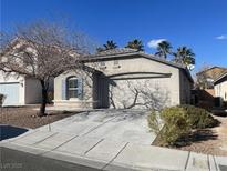 Charming single-story home with a well-maintained front yard and a spacious driveway at 4912 Hostetler Ave, Las Vegas, NV 89131