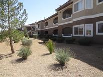 A beautiful condo exterior featuring desert landscaping and a welcoming facade at 833 Aspen Peak Loop # 1524, Henderson, NV 89011