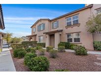 Charming two-story home with blue shutters and well-maintained landscaping at 11428 Belmont Lake Dr # 104, Las Vegas, NV 89135