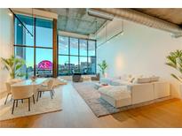 Bright living space featuring floor-to-ceiling windows and stylish modern furniture at 360 E Desert Inn Rd # 604, Las Vegas, NV 89109