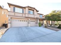 Inviting two-story home with a large driveway and a two-car garage providing ample parking at 7329 Daily Double Ave, Las Vegas, NV 89129