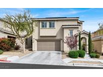 Charming two-story home with a well-manicured lawn and an attached two-car garage at 9138 Sea Mink Ave, Las Vegas, NV 89149