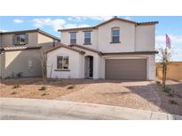 Charming two-story home featuring a brick driveway, neutral stucco, and a two-car garage at 107 Bella Nice Dr, Henderson, NV 89015