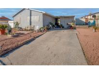 Cozy single-story home with a long driveway, mature landscaping, and a welcoming front porch at 2229 La Puente St, Las Vegas, NV 89115