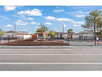 Charming single-story home with a meticulously landscaped front yard and black metal fence at 5168 Wilbur St, Las Vegas, NV 89119