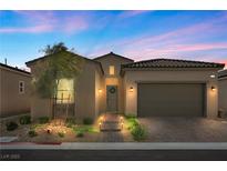 Charming single-story home with a well-manicured front yard, desert landscaping, and a two-car garage at 8705 Fordster St, Las Vegas, NV 89166