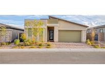 Charming home featuring modern architectural elements and a manicured front yard at 924 Mayfield Manor Ln, Las Vegas, NV 89138