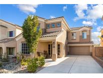 Charming two-story home featuring a tile roof, well-maintained landscaping, and an attached two-car garage at 9533 Solitude Canyon Ave, Las Vegas, NV 89149