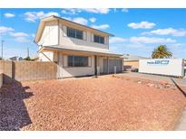 Charming two-story home with an oversized front yard and a two car garage at 212 Huntly Rd, Las Vegas, NV 89145