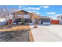 Charming single-story home featuring a long driveway and low maintenance landscaping at 308 Fox Cir, Las Vegas, NV 89107