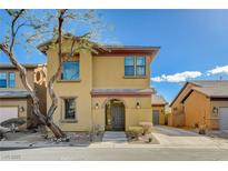 Charming two-story home boasts a welcoming arched entryway and a well-maintained front yard landscape at 3932 Maldive Isle Ct, Las Vegas, NV 89129