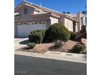 Charming single-story home with a well-maintained front yard and a two-car garage at 5366 Runningbrook Rd, Las Vegas, NV 89120