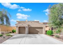 Charming single story home with a two-car garage and a well maintained desert landscape at 6733 Fast Brook Ct, North Las Vegas, NV 89084