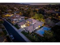 Stunning aerial view of the estate featuring a private basketball court and lush landscaping at 68 Isleworth Dr, Henderson, NV 89052