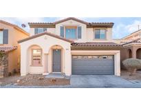 Charming two-story home with a two-car garage and desert landscaping in a residential neighborhood at 8045 Sundance Valley Dr, Las Vegas, NV 89178