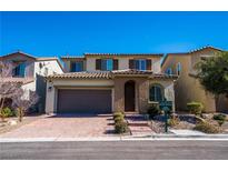 Charming two-story home with a brick driveway and two-car garage in a desirable neighborhood at 12816 Alcores St, Las Vegas, NV 89141