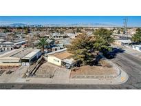 Charming single-story home featuring a well-maintained yard and mature trees in a residential neighborhood at 359 Sir Jeffery St, Las Vegas, NV 89110