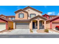 Charming two-story home featuring a two-car garage and covered porch, perfect for Gathering living at 5507 Nickel Ridge Way, Las Vegas, NV 89122