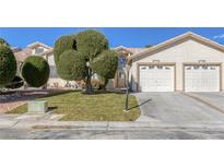 Charming home featuring a well-manicured lawn and a two-car garage, perfect for suburban living at 5732 Colwood Ln, Las Vegas, NV 89130