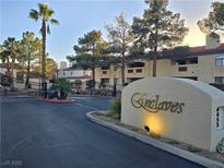 Well-maintained community entrance with mature trees and manicured landscaping at 8455 W Sahara Ave # 258, Las Vegas, NV 89117