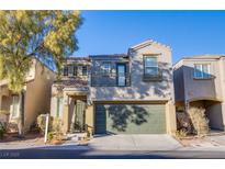 Charming two-story home featuring a balcony, two-car garage, and desert landscaping at 9144 Epworth Ave, Las Vegas, NV 89148