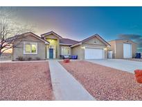 Charming single-story home with a two-car garage and a separate storage building at 1464 Barlow Ave, Moapa, NV 89025