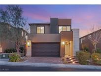 Contemporary two-story home showcasing a modern design, two-car garage and professional landscaping at 2153 Havensight Ln, Henderson, NV 89052