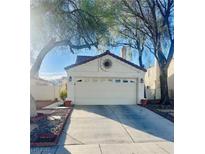 Charming home featuring a spacious two-car garage and an ample concrete driveway at 3916 Rhine Way, Las Vegas, NV 89108