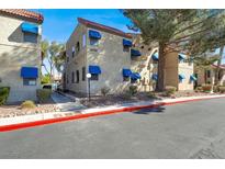 Exterior of home with awnings, desert landscaping, and well maintained sidewalks at 4722 Obannon Dr # D, Las Vegas, NV 89102