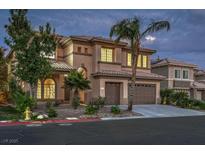 A home with a three-car garage, desert landscaping, and a tile roof stands in the foreground at 4664 Stuttgart St, Las Vegas, NV 89147