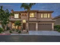 An inviting two-story stucco home features a three-car garage, desert landscaping, and a classic tile roof at 4664 Stuttgart St, Las Vegas, NV 89147