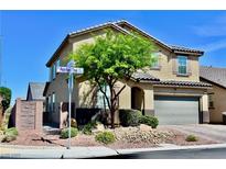 Beautiful two story home with a well manicured front yard and mature landscaping at 5705 Petrified Tree Ln, North Las Vegas, NV 89081