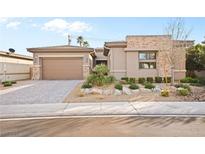 Charming single-story home featuring desert landscaping and a two-car garage at 7417 Deschutes Cir, Las Vegas, NV 89129