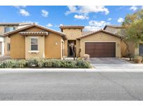 Charming single-story home with stucco exterior, desert landscaping, and a two-car garage at 2592 Early Sky Ct, Las Vegas, NV 89142