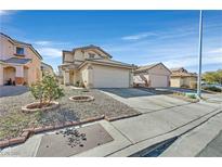 Tan two-story home featuring attached garage, landscaped yard and desert landscaping under bright blue skies at 9563 Grapeland Ave, Las Vegas, NV 89148