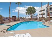 Enjoy this community pool on a beautiful day with palm trees and ample seating at 1381 E University Ave # 301, Las Vegas, NV 89119