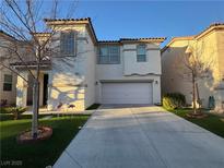 Two-story home featuring an attached two-car garage and neat landscaping at 180 Country Greens Ave, Las Vegas, NV 89148
