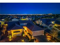 Stunning exterior view of a single-story home featuring a red-tile roof and a spacious two-car garage at 2720 Spalding Dr, Las Vegas, NV 89134