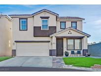 Charming two-story home featuring a front lawn, a two-car garage, and a covered entry way at 3971 Silver Saber Ct, Las Vegas, NV 89129