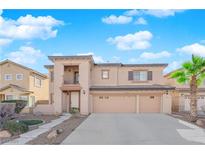 Two-story home featuring a three-car garage, balcony, and low-maintenance landscaping at 4063 Lower Saxon Ave, North Las Vegas, NV 89085