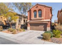 Charming two-story home featuring a two-car garage and desert landscaping at 4740 Killington St, Las Vegas, NV 89129