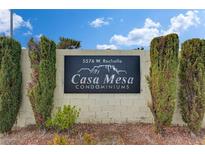 Community signage for Casa Mesa Condominiums, with manicured landscaping and clear address visibility at 5576 W Rochelle Ave # 30C, Las Vegas, NV 89103