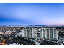 Stunning aerial view of luxury high-rise condos against a vibrant Las Vegas skyline at 9103 Alta Dr # 1502, Las Vegas, NV 89145