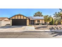 Charming one-story home featuring a two-car garage, solar panels, and low maintenance landscaping at 3337 Irv Marcus Dr, Las Vegas, NV 89108