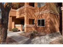 Beautiful multi-story building with a light brown exterior and well maintained landscaping at 378 Colleen Ct # G, Mesquite, NV 89027